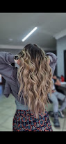 Blonde balayage hair styled at Be-You-Tiful Hair Salon, look 1